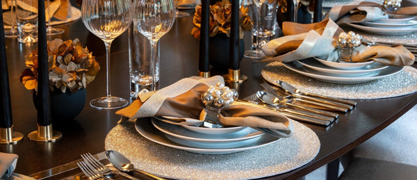 Modern table setu-up with glassware, placemats, napkins & napkin rings 