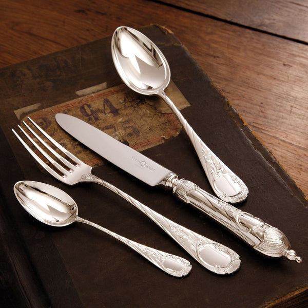 Luxury dinner spoon, fork, knife with engraved scroll ornaments.