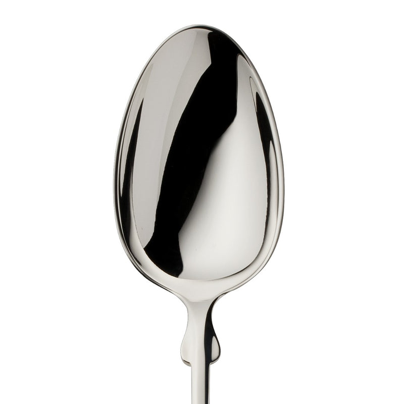 Children’s spoon Spaten silver-plated close-up on its bowl.