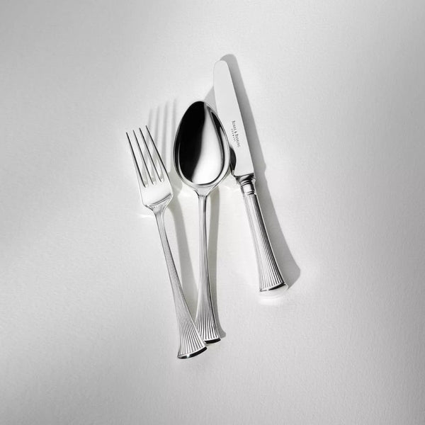 Avenue silver-plated table spoon arranged beside matching fork and knife.