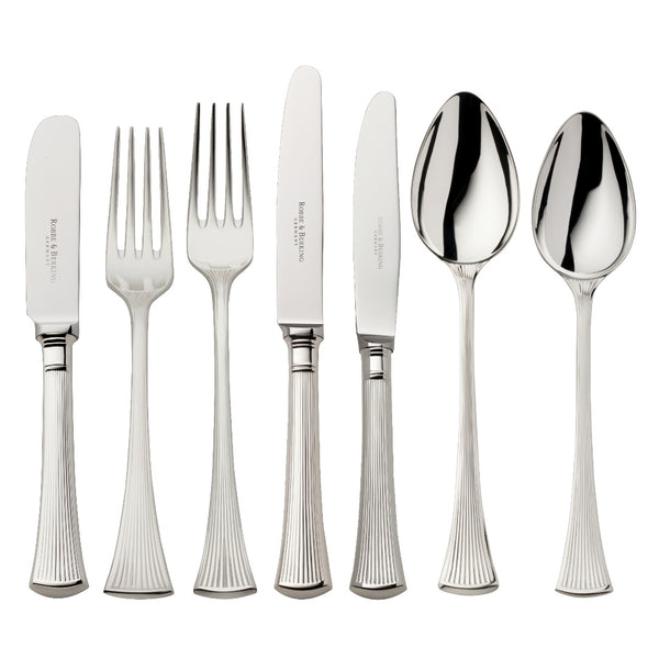 Silver-plated 84-piece Avenue cutlery set with sculpted ridges reflecting light on a luxurious table