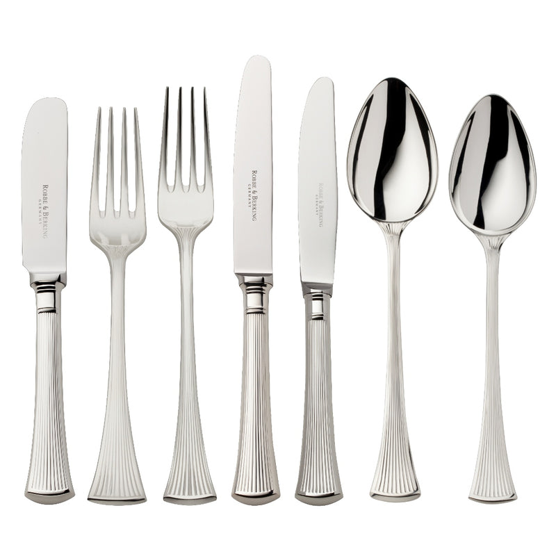 Silver-plated 84-piece Avenue cutlery set with sculpted ridges reflecting light on a luxurious table