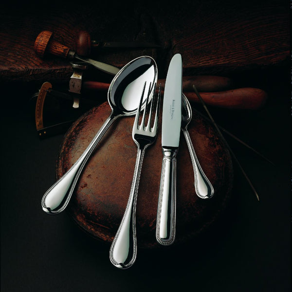 Silver-plated Französisch-Perl menu fork next to menu knife and spoon.