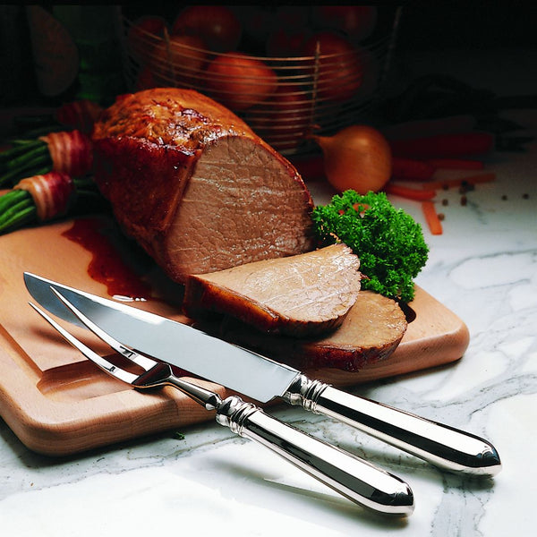 Robbe & Berking Navette silver-plated carving fork with carving knife, cutting roast.
