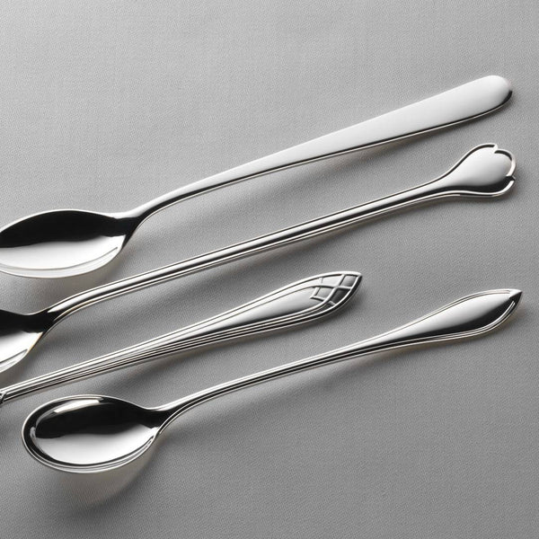 Robbe & Berking Navette silver-plated long drink spoon next to long spoons from different collections.