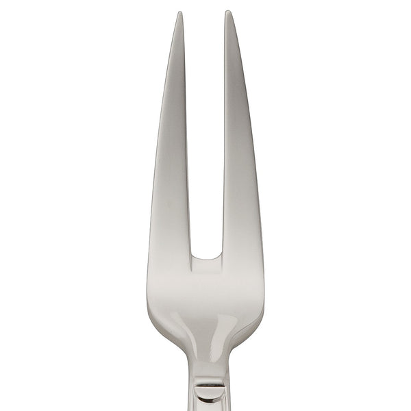 Small meat fork Art Deco silver-plated close-up on its pointy prongs