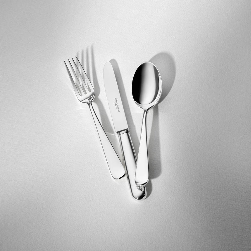 Dante silver-plated dessert spoon displayed next to spoon and knife