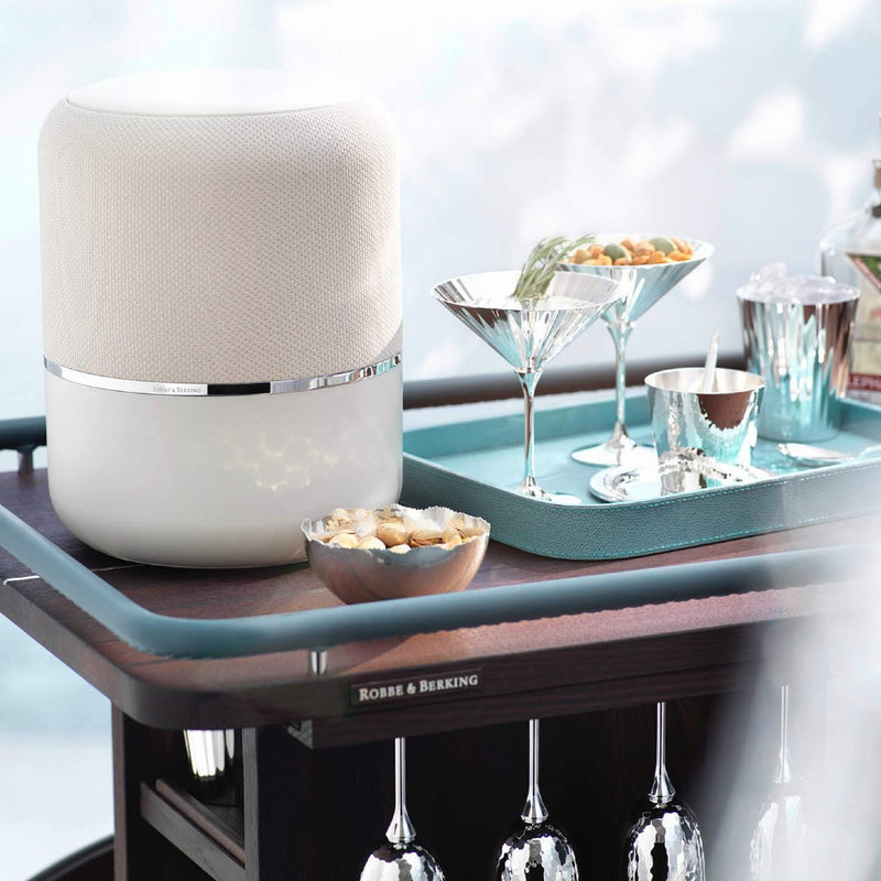 Dante silver-plated cutlery in creme presentation box closed box on luxury bar table.