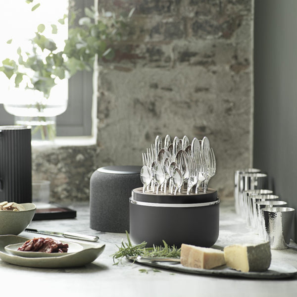 Grey box Riva with cutlery on elegant tablescape.