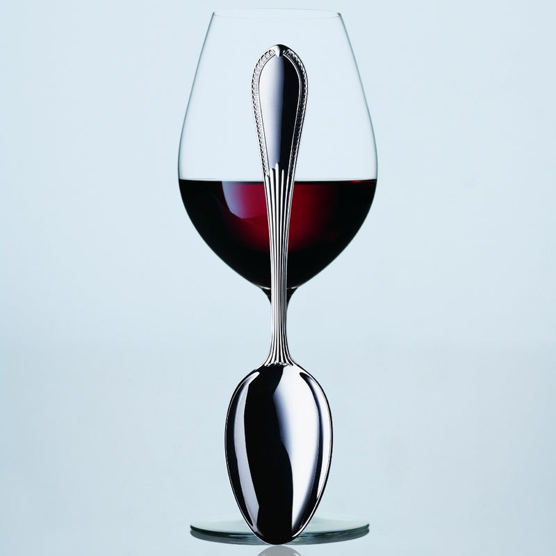 Belvedere silver plated menu spoon by Robbe & Berking in front of wine glass. 