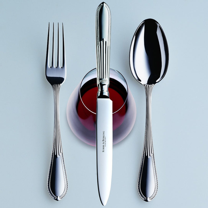 Belvedere silver plated menu spoon by Robbe & Berking next to fork and knife.