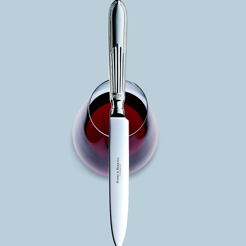 Belvedere silver plated menu knife by Robbe & Berking on wine glass.