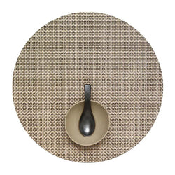 Chilewich round latte placemat with basketweave pattern.