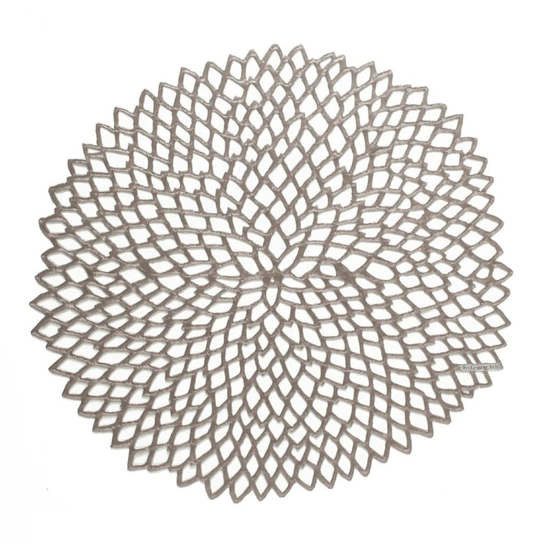Chilewich Dahlia gunmetal round vinyl placemat with lace-cut detail.