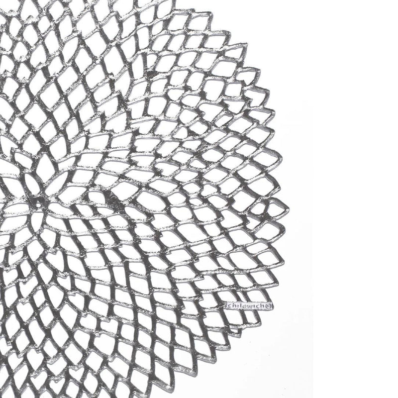 Chilewich Dahlia silver round vinyl placemat with lace-cut detail close-up.