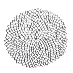 Chilewich Dahlia silver round vinyl placemat with lace-cut detail.