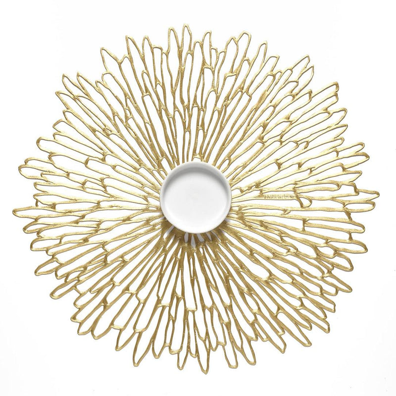 Gold Bloom round placemat with chrysanthemum openwork by Chilewich.