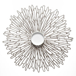 Gunmetal grey Bloom round vinyl placemat by Chilewich.