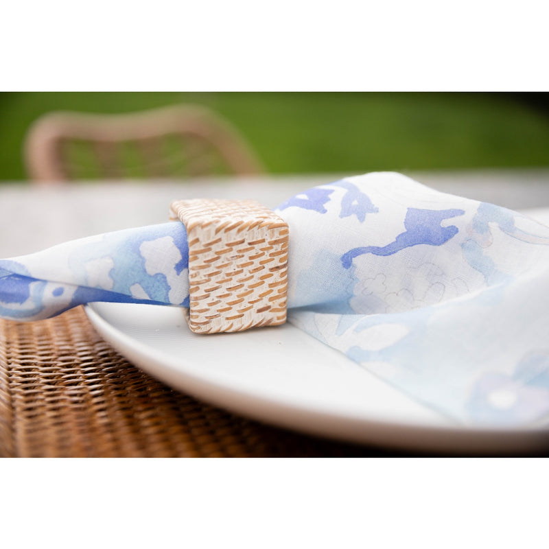 Seaside-inspired table featuring square rattan napkin ring by Bamboo Source