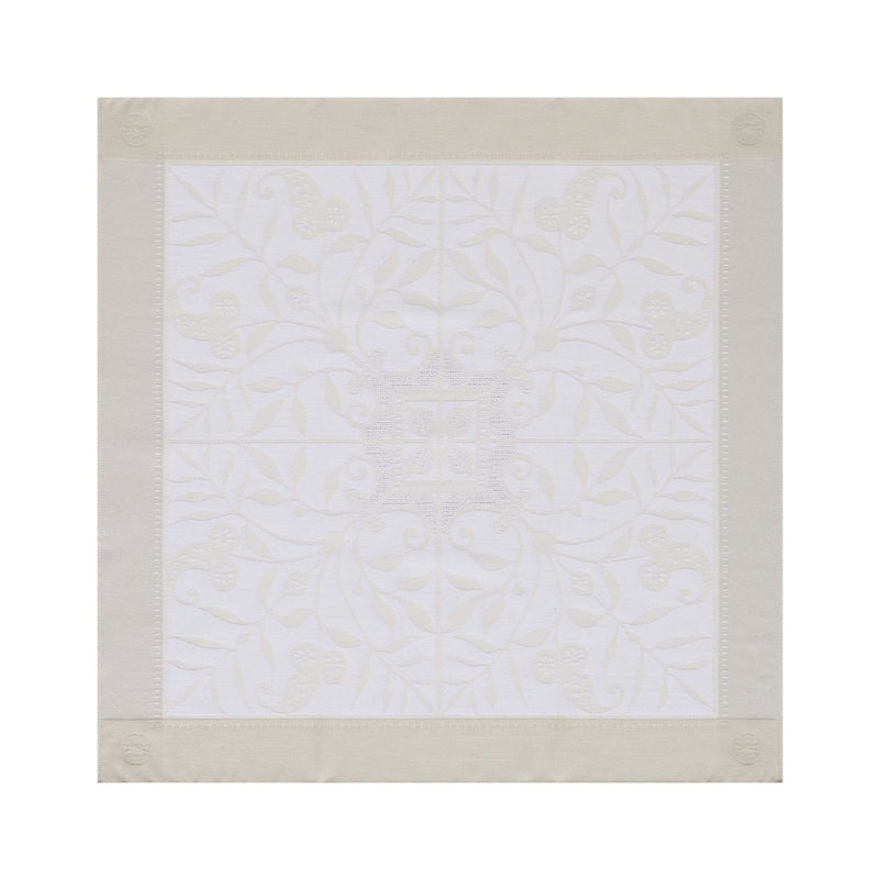 Venezia cotton napkin with subtle ivory floral pattern and classic silhouette, on white background