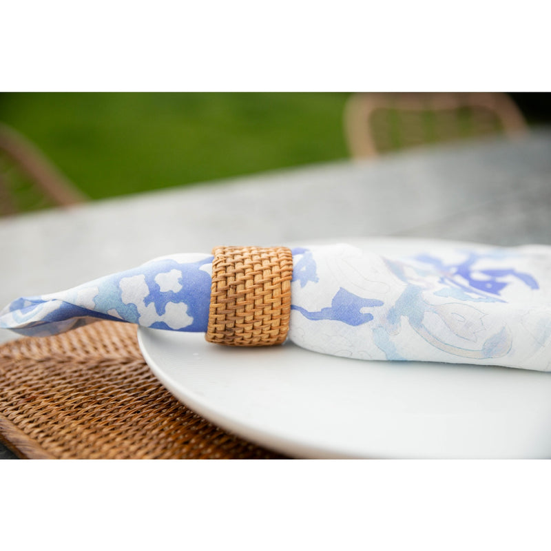 Beach-style table with natural Round Rattan Napkin Ring on white napkin