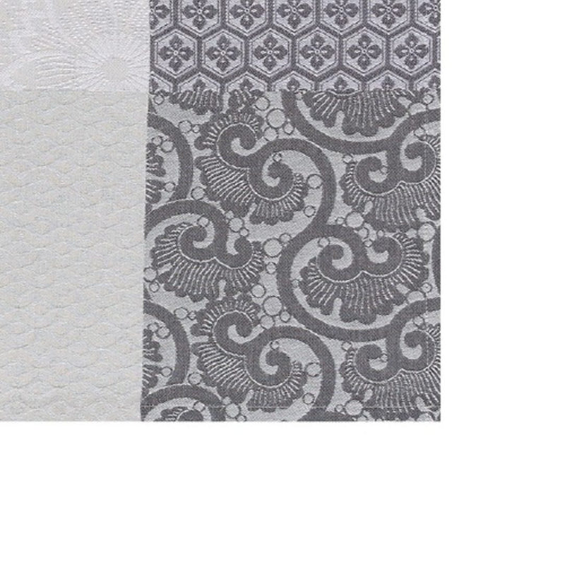 Mist grey cotton placemat with Japanese floral motifs close-up.