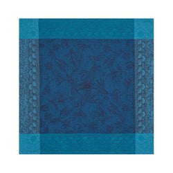 Unwraped Symphonie Baroque blue linen napkin by Le Jaquard Francais on white background, sold at Amiramour.
