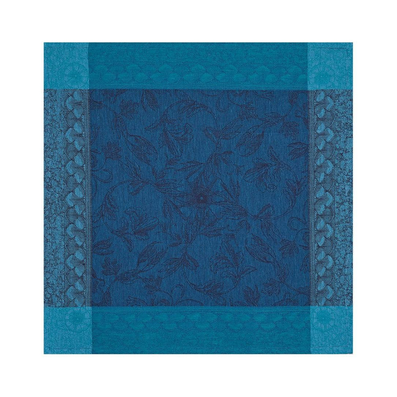 Unwraped Symphonie Baroque blue linen napkin by Le Jaquard Francais on white background, sold at Amiramour.