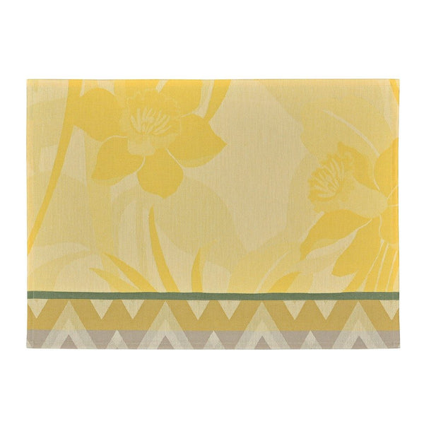 Yellow coated cotton placemat with jacquard daffodil and chevron design by Le Jaquard Francais.