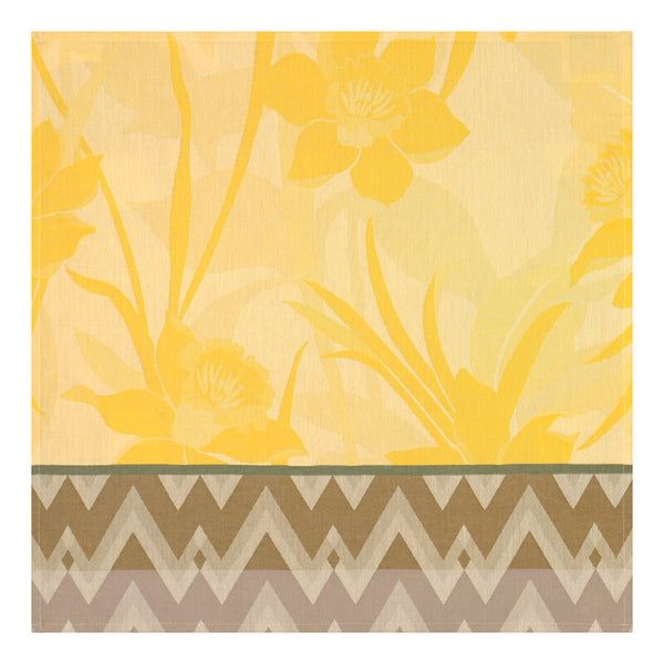Yellow coated napkin with daffodils and chevron pattern by Le Jaquard Francais.