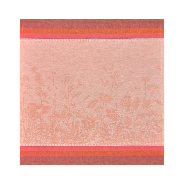 Coral floral linen napkin by Le Jacquard Français unwrapped on white background.