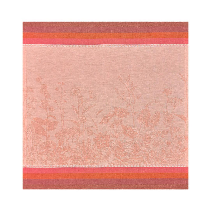 Coral floral linen napkin by Le Jacquard Français unwrapped on white background.
