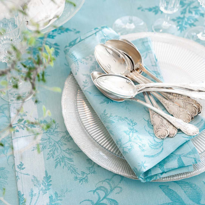 Close-up of soft ivy and calathea motifs on Jardin d’Eden napkin by Le jaquard Francais, sold at Amiramour.
