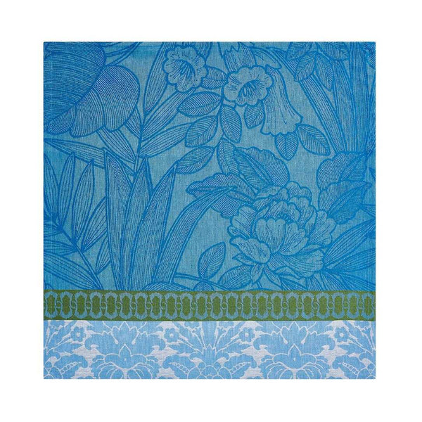 Escapade Tropicale linen napkin in blue by Le Jaquard Francais unwraped on white background, sold by Amiramour.