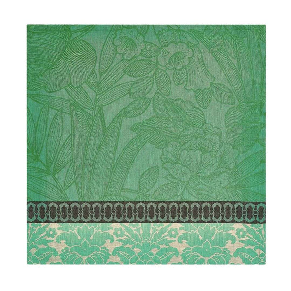 Escapade Tropicale linen napkin in green by Le Jaquard Francais unwraped on white background.