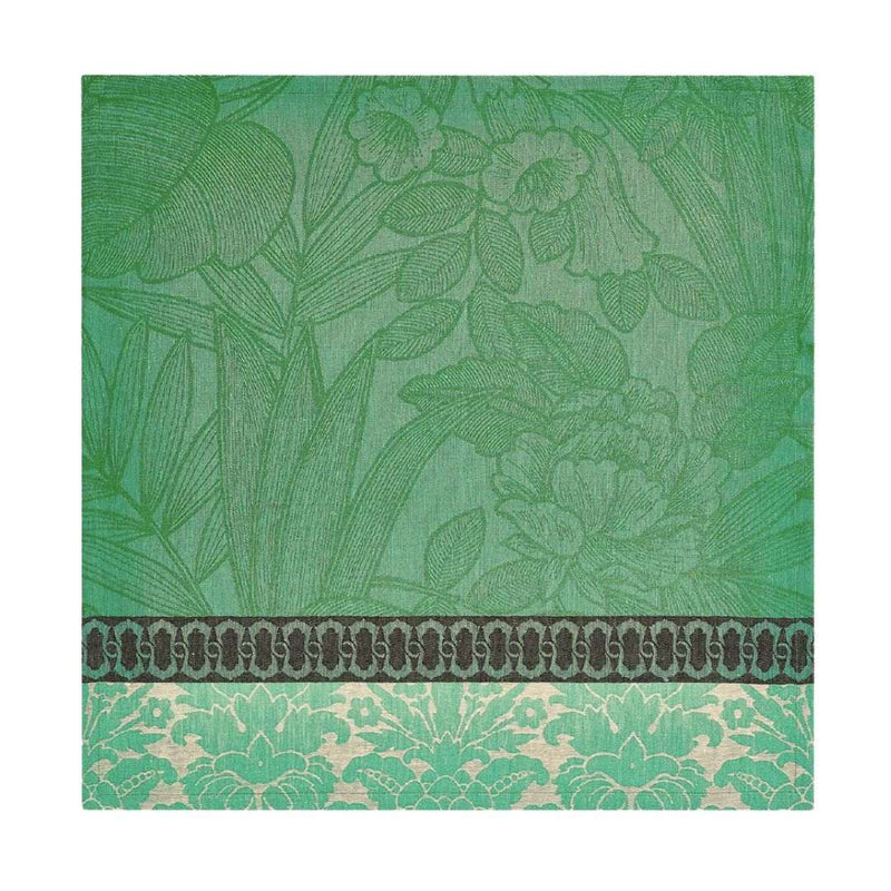 Escapade Tropicale linen napkin in green by Le Jaquard Francais unwraped on white background.