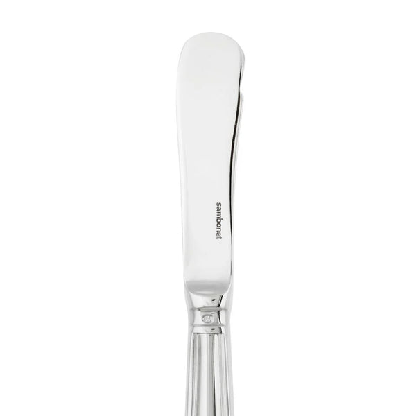 Contour butter knife by Sambonet in stainless steel with polished mirror finish, close-up on blade.