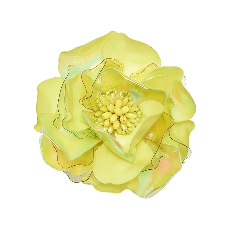 Top view of Gardenia Napkin Ring in citron by Kim Seybert, with detailed lime green petals on a white background