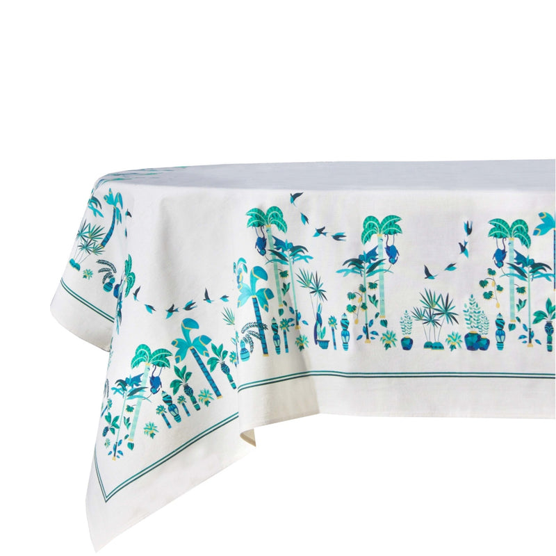 "a white tablecloth with blue and green designs "