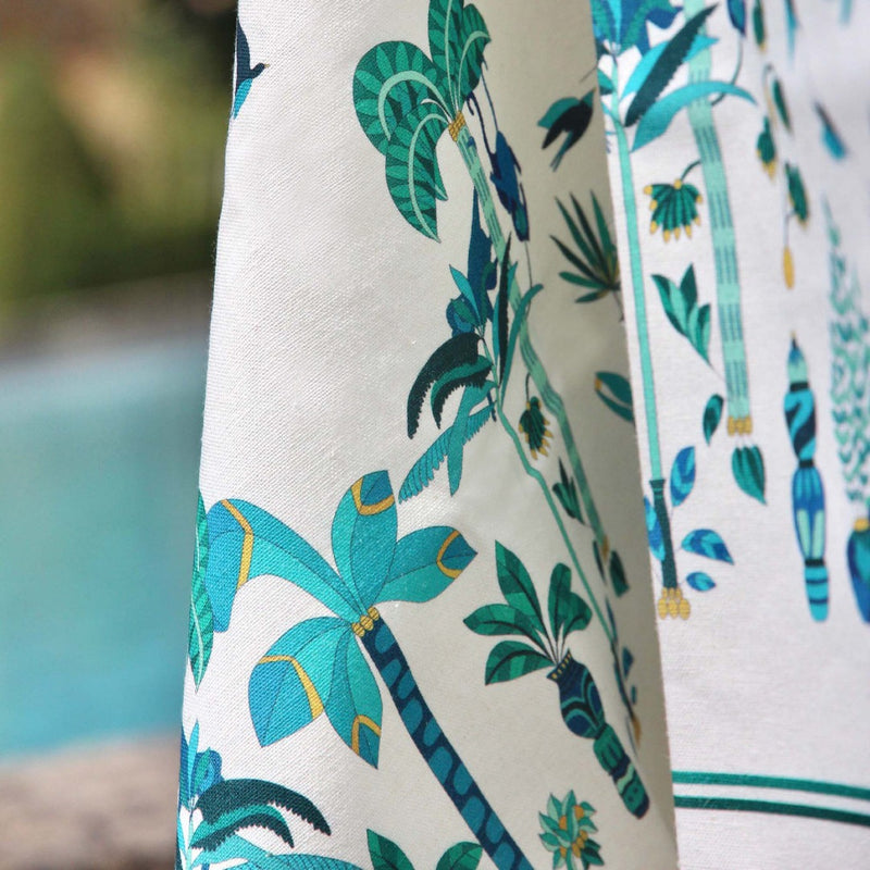a towel with palm trees and blue and white design