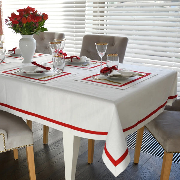 Elegant white tablecloth with red stripe border made from 100% Italian cotton.