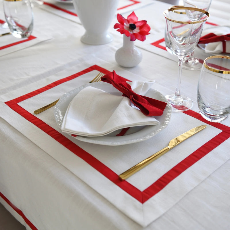 Elegant white tablecloth with red stripe border made from 100% Italian cotton.