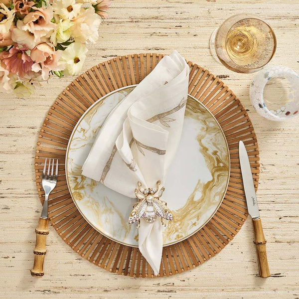 Brown Spoke bamboo placemat in hand-cut geometric design styled with white napkin.