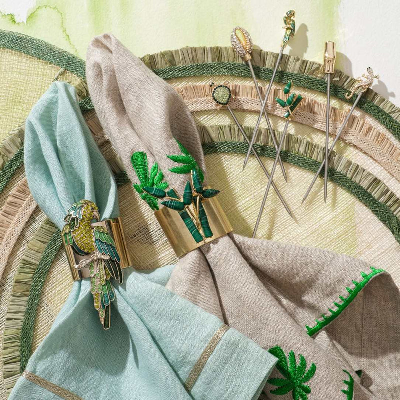 Parrot napkin rings by Joanna Buchanan styled with blue napkin.