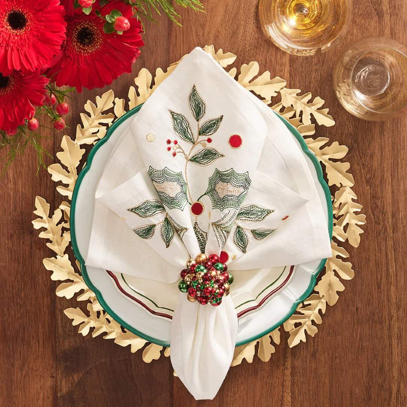 Gold Gilded Leaves charger with layered wreath-like leaf design by Kim Seybert on Christmas tablescape.
