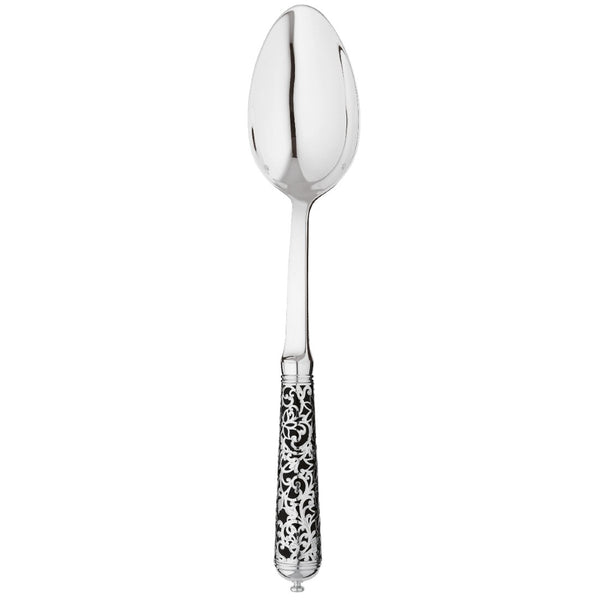 Sterling silver serving spoon with wide bowl and black handle decorated with silver arabesque motif.