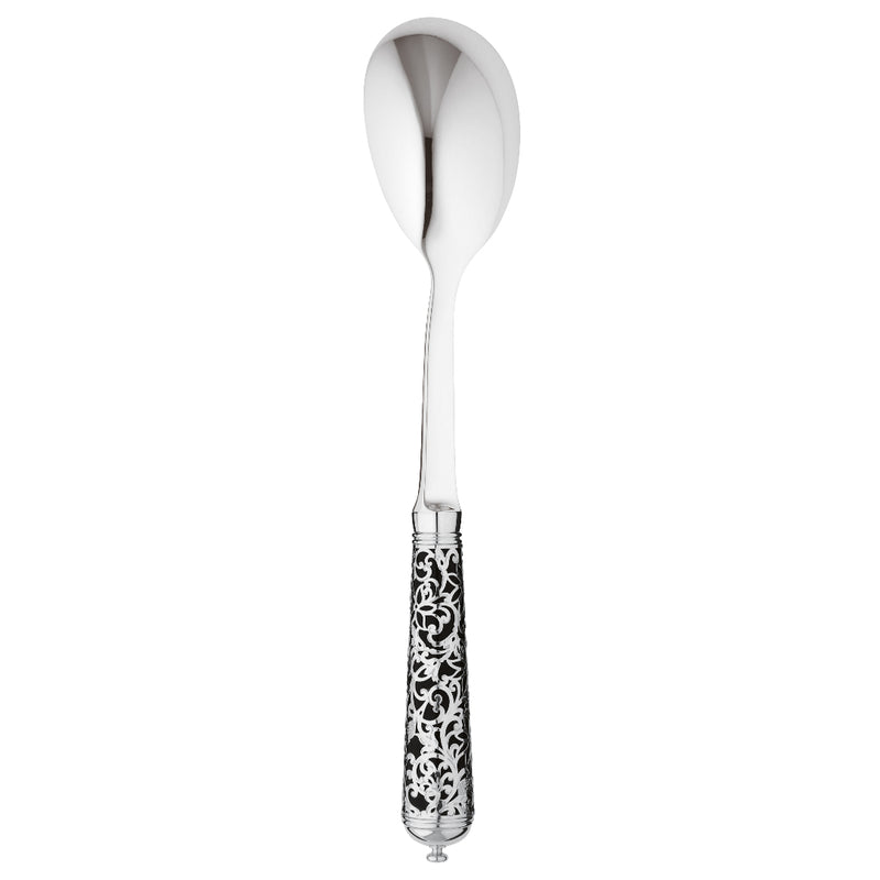 Sterling silver salad serving spoon with curved bowl and black handle decorated with silver arabesque.