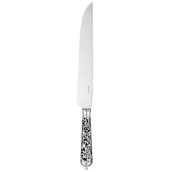 Sterling silver carving knife with long blade and black handle decorated with silver arabesque detail.