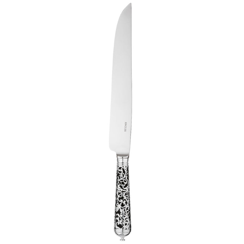 Sterling silver carving knife with long blade and black handle decorated with silver arabesque detail.