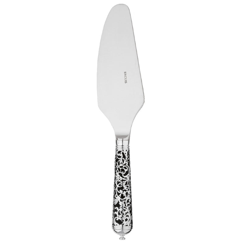 Sterling silver cake server with serrated blade and black handle decorated with silver arabesque.